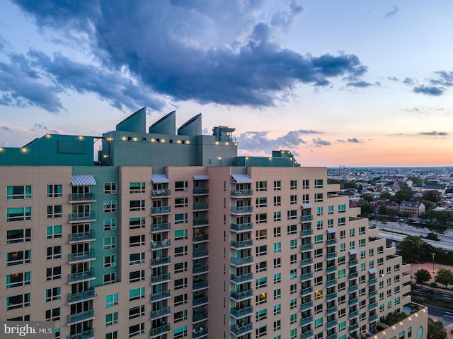 view of outdoor building at dusk