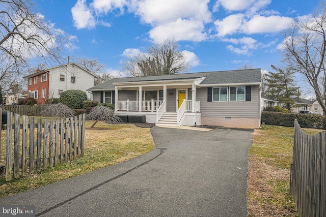 view of front of house with a porch and a front yard