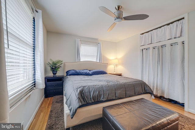 bedroom with light wood-type flooring and ceiling fan