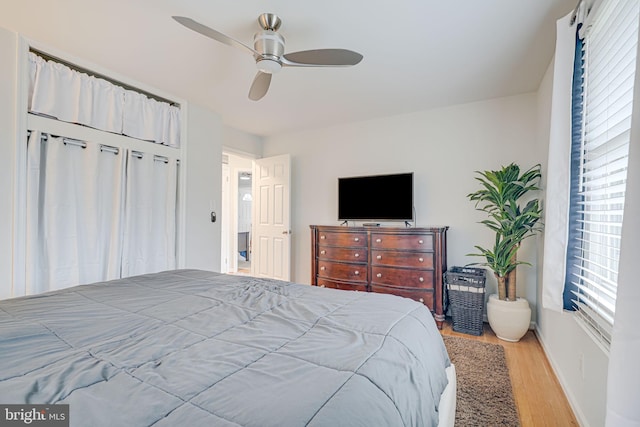 bedroom featuring light wood-type flooring and ceiling fan