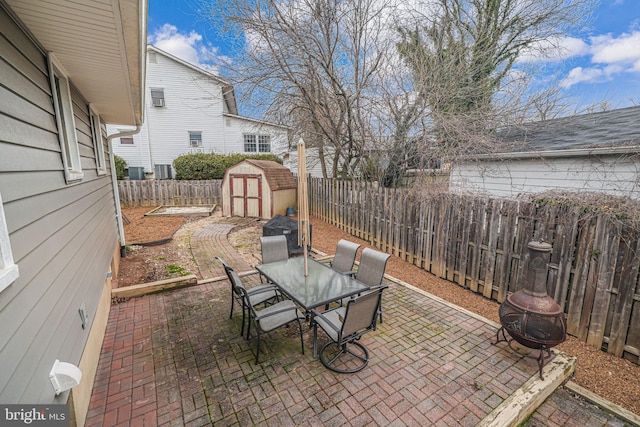 view of patio / terrace with a storage shed