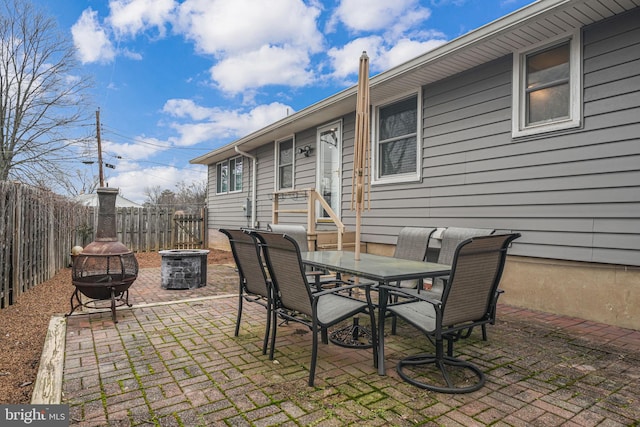 view of patio featuring an outdoor fire pit