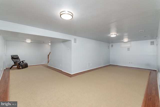 finished basement featuring carpet and baseboards