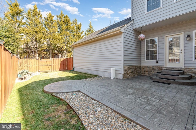 view of patio with entry steps and a fenced backyard