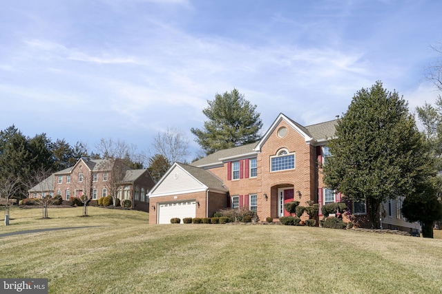 view of front of house featuring a garage, brick siding, and a front yard