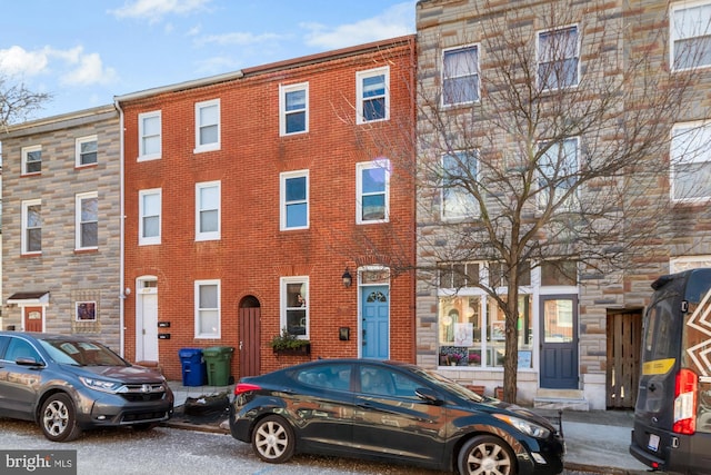 view of front of home featuring brick siding