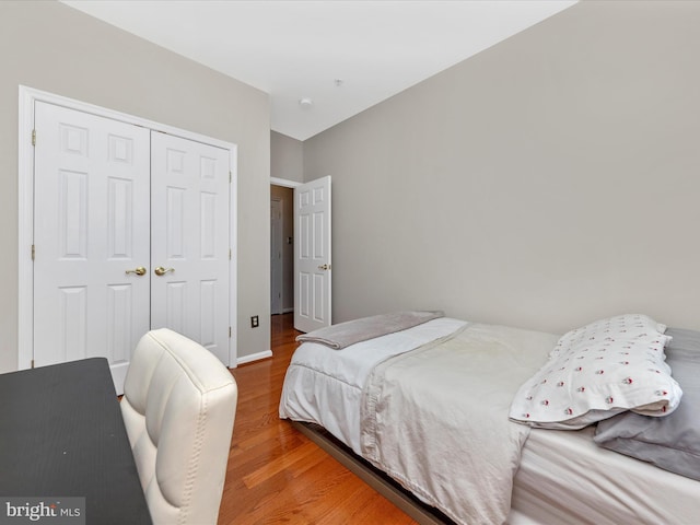 bedroom featuring a closet and hardwood / wood-style flooring