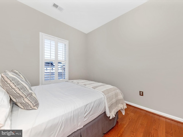 bedroom featuring hardwood / wood-style flooring