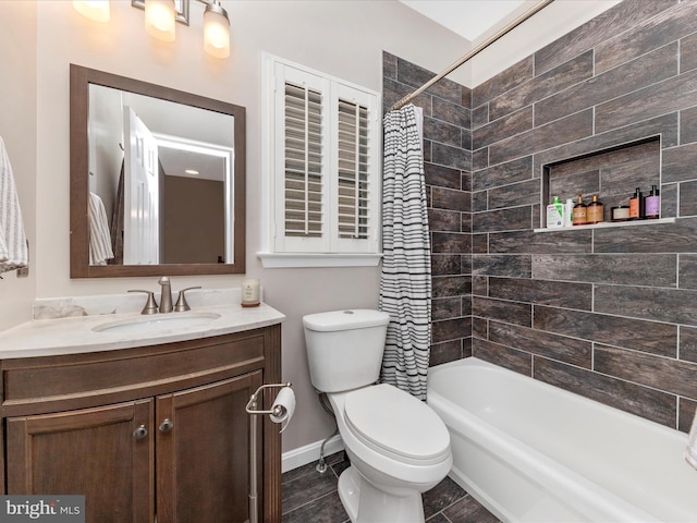 full bathroom with vanity, toilet, and shower / bath combo with shower curtain