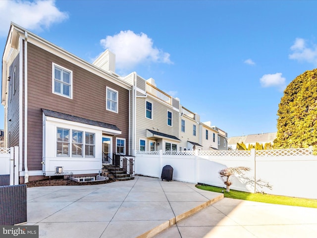 back of property featuring a patio