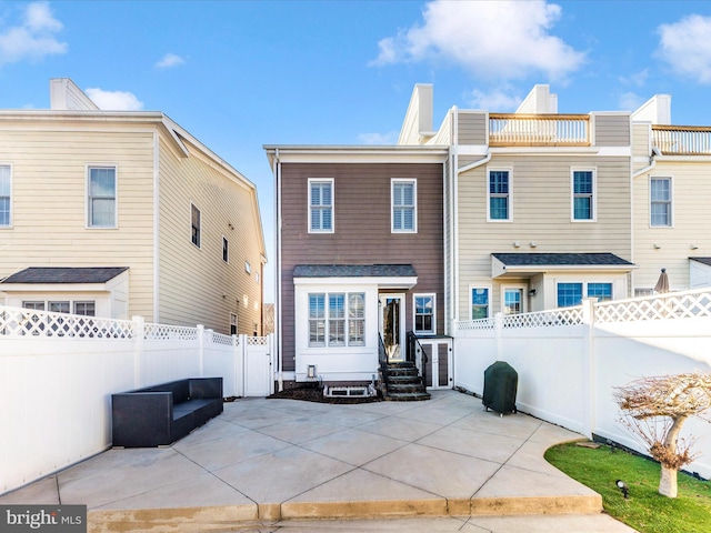 back of property with a patio area