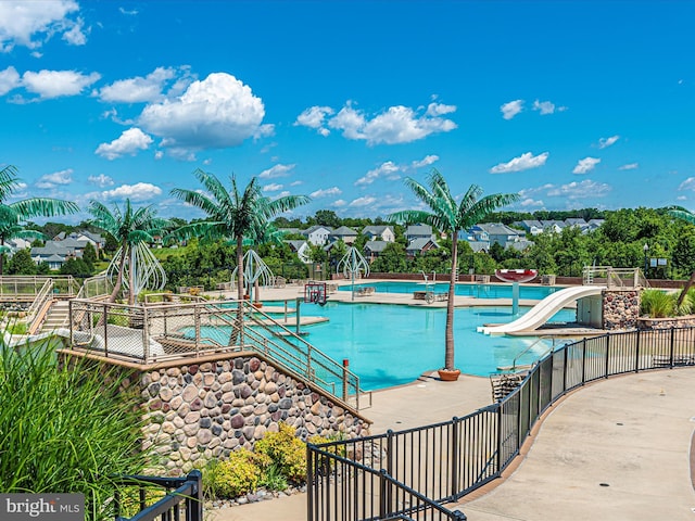 view of swimming pool with a patio