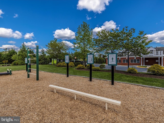 view of home's community with a playground and a lawn