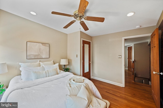 bedroom with recessed lighting, ceiling fan, baseboards, and wood finished floors