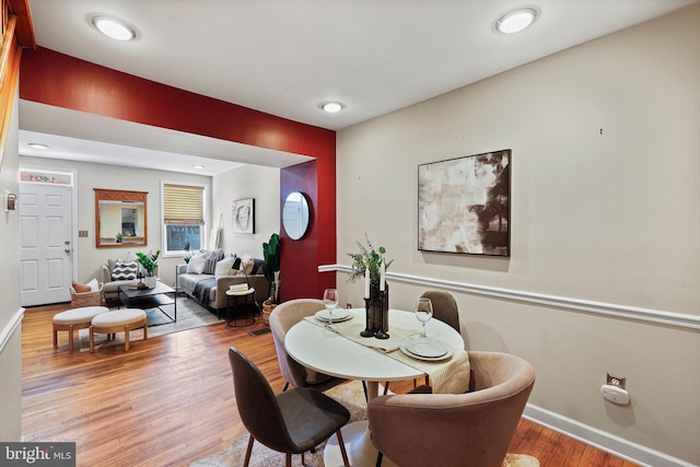 dining room with wood finished floors and baseboards