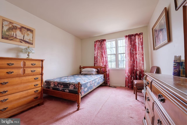 bedroom featuring light colored carpet