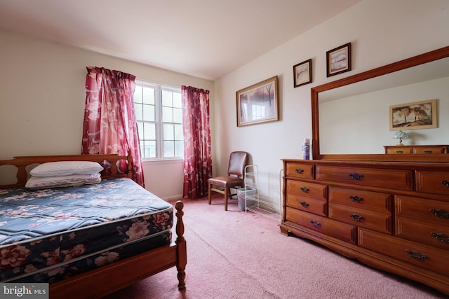 bedroom featuring light colored carpet