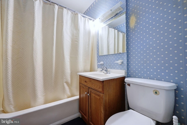 full bath featuring shower / bath combination with curtain, vanity, toilet, and wallpapered walls