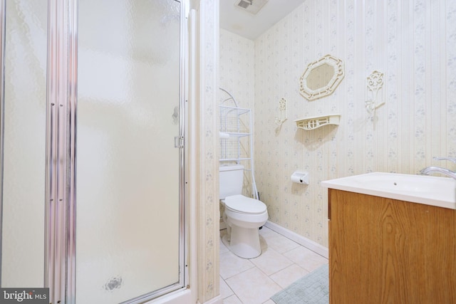 full bathroom featuring wallpapered walls, toilet, a shower stall, vanity, and tile patterned floors