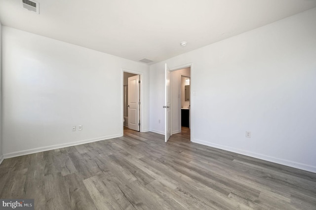 unfurnished bedroom featuring hardwood / wood-style floors