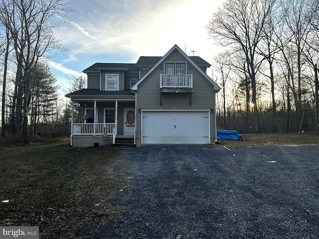 view of front property with a garage and covered porch