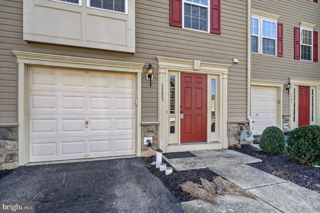 doorway to property featuring a garage