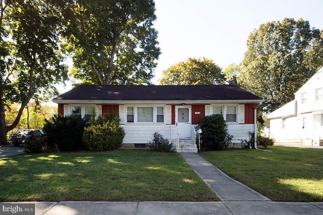 ranch-style home with a front lawn