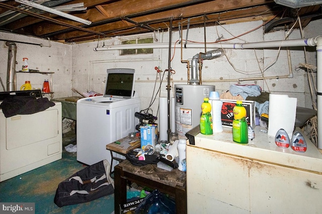 unfinished basement featuring gas water heater and washing machine and clothes dryer