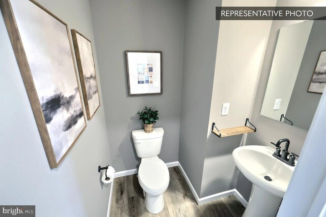 109 Weston Cir Lot 86, Duncannon, PA 17020 - bathroom with sink, toilet, and hardwood / wood-style floors