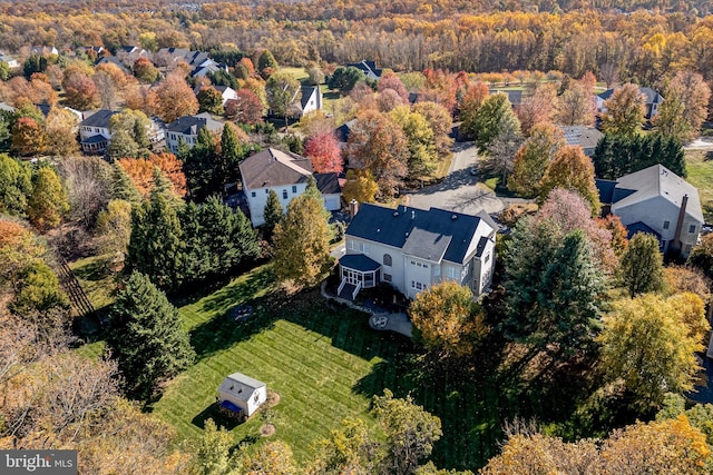 birds eye view of property with a residential view