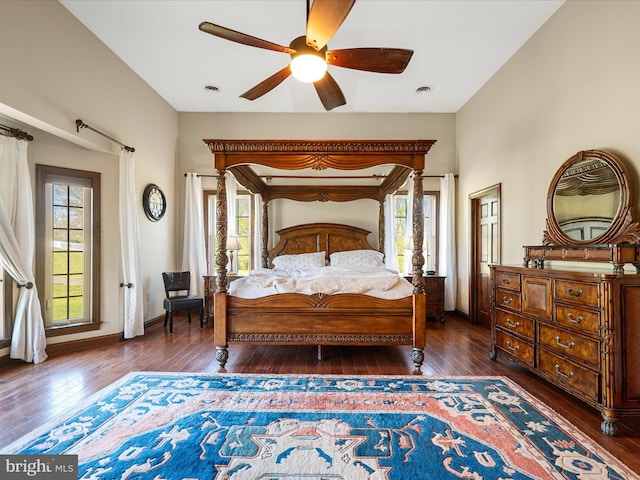 bedroom featuring baseboards, ceiling fan, and hardwood / wood-style floors