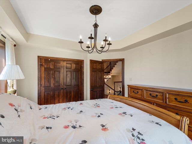 bedroom featuring a chandelier
