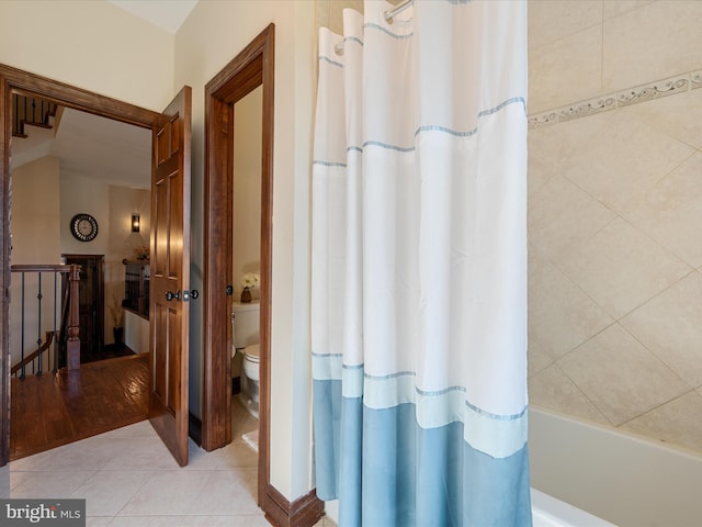 full bath featuring toilet and tile patterned floors