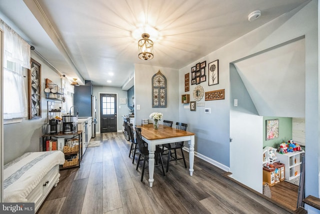 dining room with dark hardwood / wood-style floors