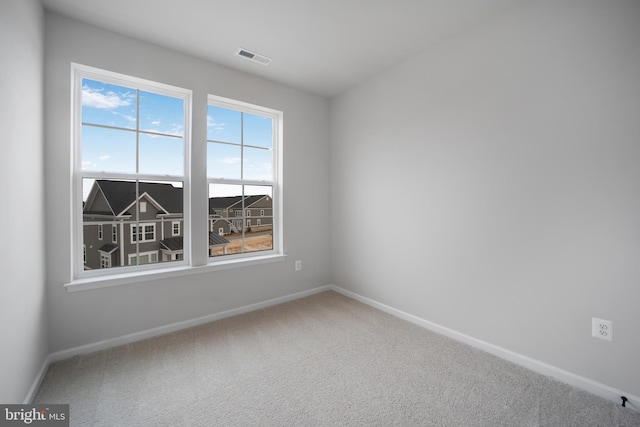 unfurnished room featuring carpet