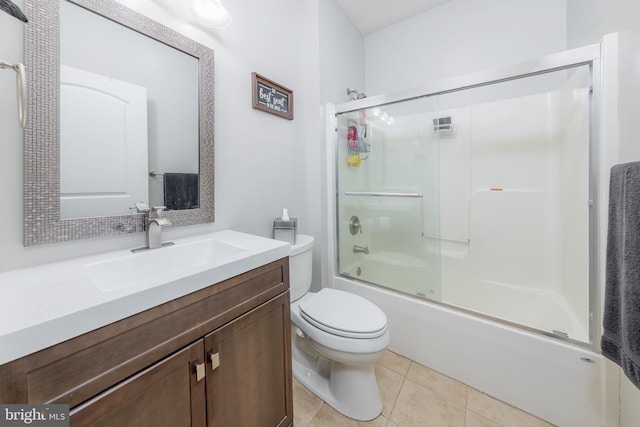 full bathroom with toilet, tile patterned flooring, bath / shower combo with glass door, and vanity