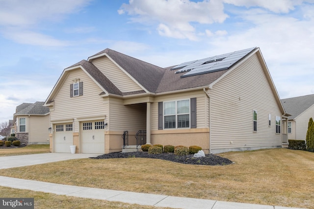 view of front of property with concrete driveway, an attached garage, a front lawn, and solar panels