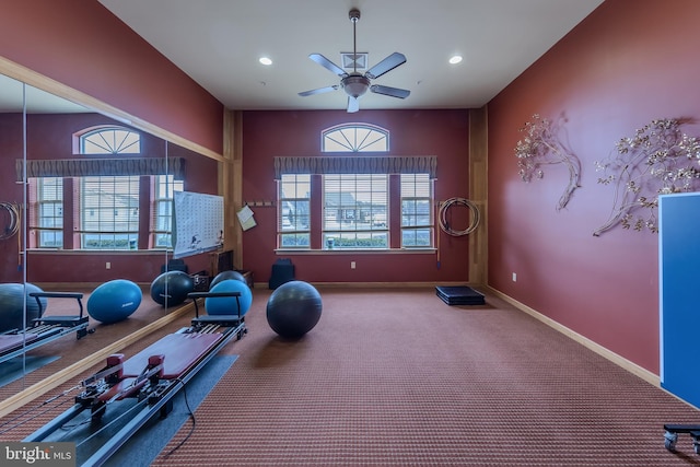 exercise area featuring baseboards, a wealth of natural light, and recessed lighting