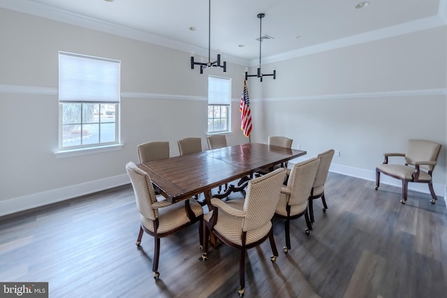 dining area featuring ornamental molding, a healthy amount of sunlight, and baseboards