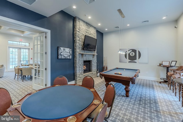 game room featuring carpet floors, a fireplace, visible vents, and baseboards