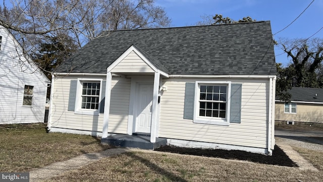 view of front of property featuring roof with shingles