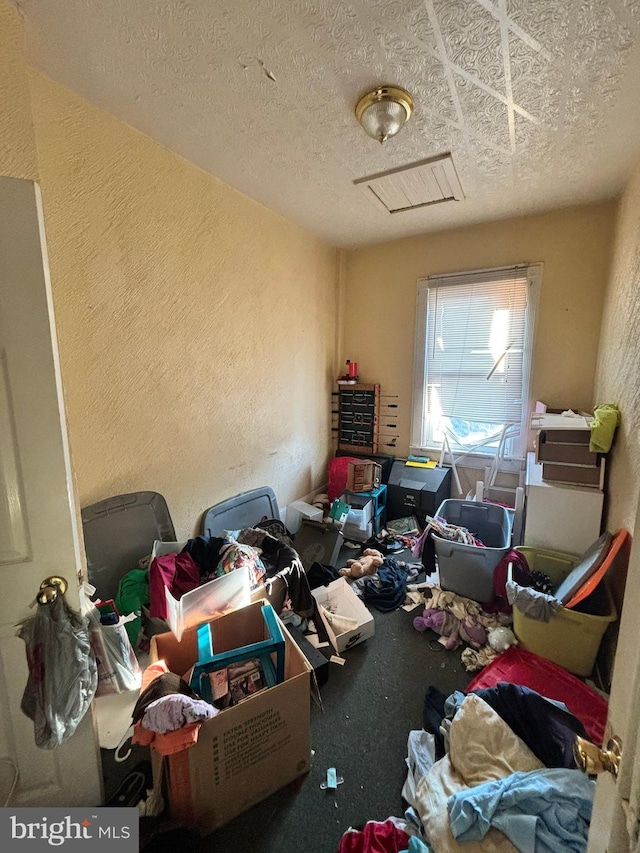 miscellaneous room featuring a textured ceiling