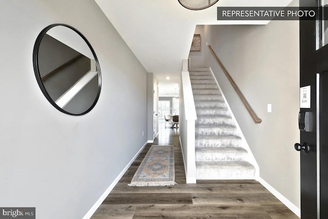 stairway with wood-type flooring