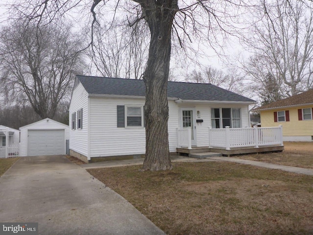 view of front of home featuring a deck, an outdoor structure, and a garage