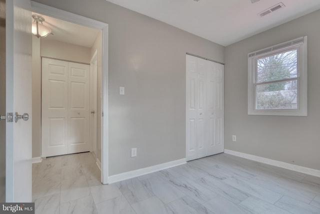 unfurnished bedroom featuring a closet