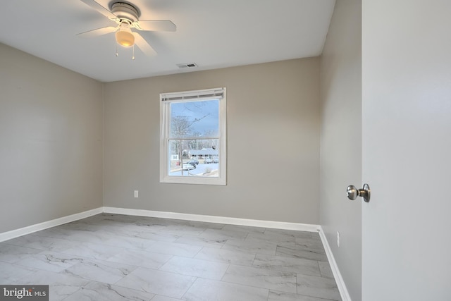 spare room with ceiling fan