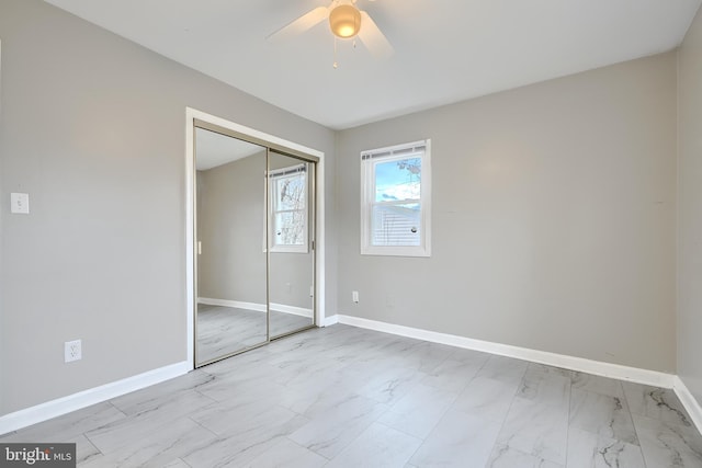 unfurnished bedroom with a closet and ceiling fan