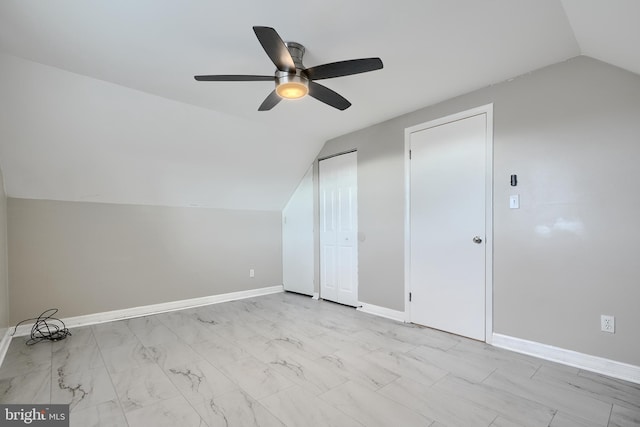 additional living space with lofted ceiling and ceiling fan