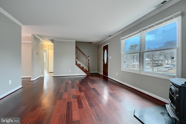 interior space featuring crown molding and dark hardwood / wood-style floors