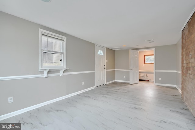 spare room with a wealth of natural light